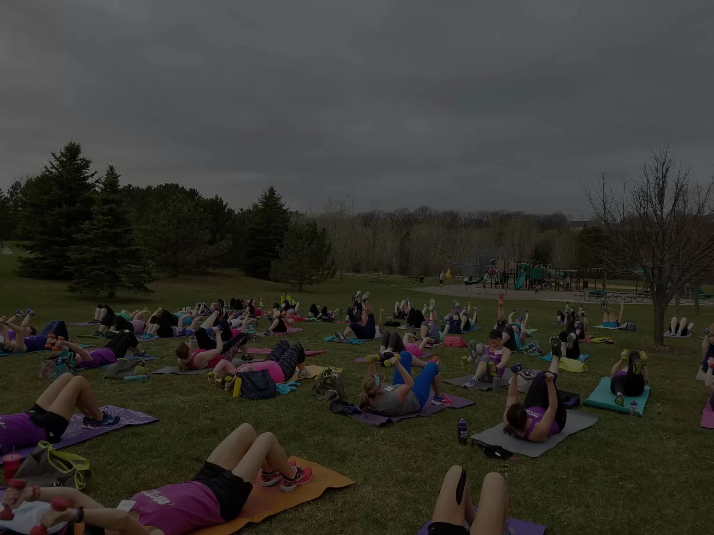 MOTR members on yoga mats with weights