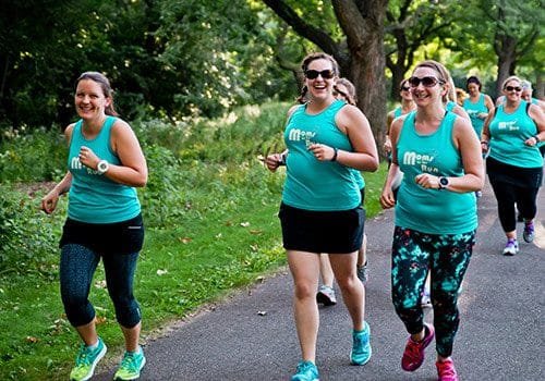 A group of MOTR members running together