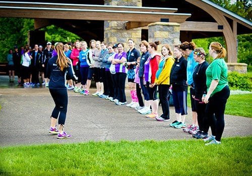 Moms on the Run coach leading women in a line