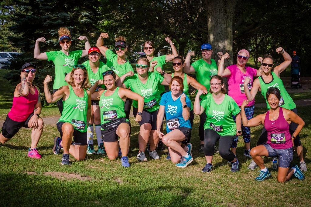 A large group of MOTR members flexing their muscles