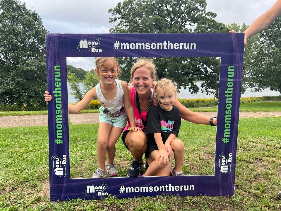 A MOTR member with her two daughters in a photo frame