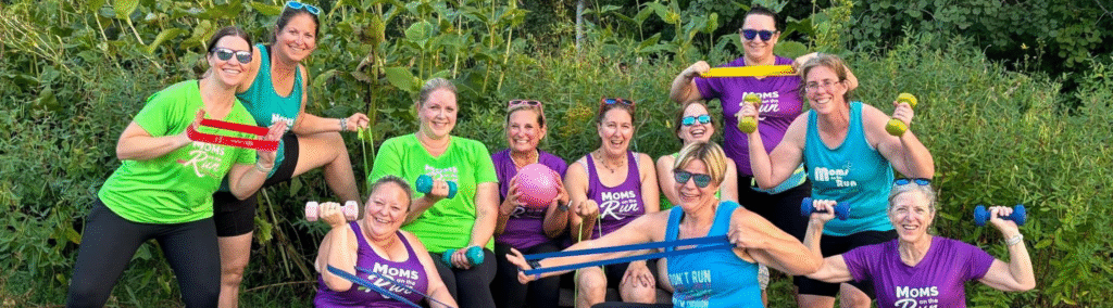 female runners outside with hand weights and other strength bands